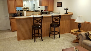 Kitchenette & Breakfast Bar Seating from living room side