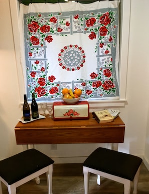 Dining nook in the kitchen comes with a bottle of Oregon wine & local cookbooks.