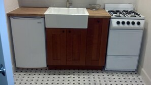 Kitchenette with farmhouse sink - also microwave (not shown)