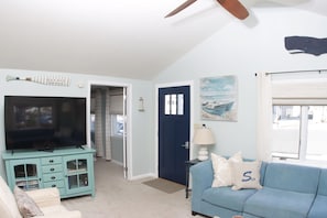 Vaulted Ceiling with large ceiling fan.