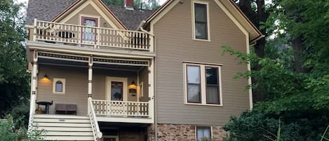 View of house and apartment from the street.  Apt entry to right of stairs.