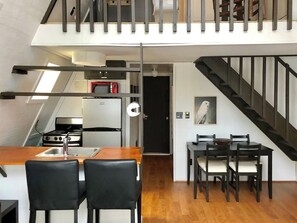 Smaller Kitchen area with counter seating oven , fridge , microwave , dishwasher - everything you need is provided. Once again- its a small galley cabin kitchen . Not a place to make a Thanksgiving feast