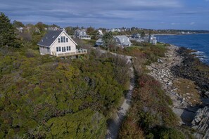 Welcome to Surfside! This is an arial frontal view of this stunning home.
