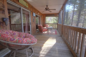 Screened-in porch where you can hang out with family and friends