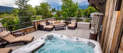 Enjoy the hot tub on the spacious roof top patio