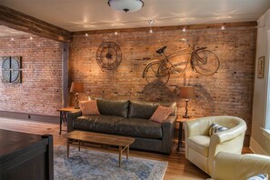 Living Area with historic brick wall.