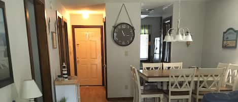 Living Room Dining Room  Area with view of main entry and kitchen entry