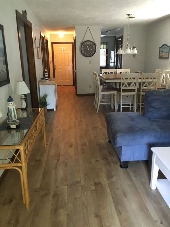Living Room Dining Room  Area with view of main entry and kitchen entry