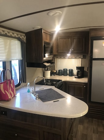 large refrigerator, oven, stove top and microwave. furnished with all utensils
