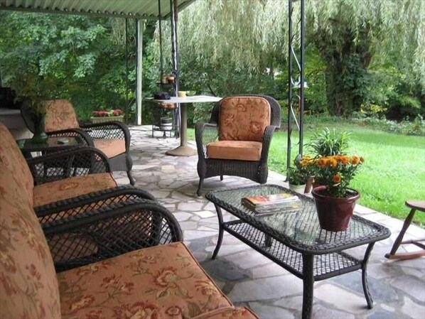 The patio overlooking the Holston River invites you to relax.