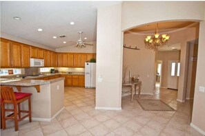 Beautiful tiled entry and kitchen.