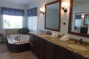 En suite master bathroom with garden tub and separate shower.  Double sinks 