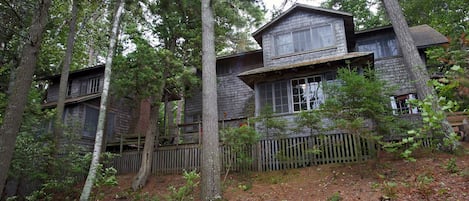 (RENTALS FOR NEXT YEAR BEGIN OCT. 1) The cottage and annex seen from the woods. 