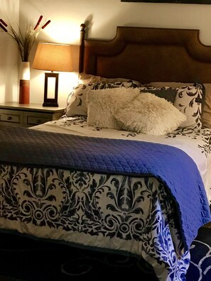 Softest sheets and cozy beds make sleeping guaranteed in this bedroom.