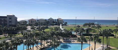 The fabulous view from our top floor balcony.  2 pools: 1 heated, one not