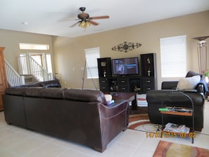 LIVING AREA WITH 51 INCH HD TV, LEATHER SECTIONAL AND COMFY LARGE CHAIR & 1/2.