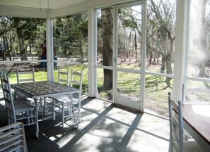 Screen porch with outside dining for at least 10
