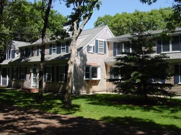 Large yard (screen porch opens to yard; 2 playhouses for young kids)