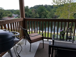 Your covered deck with lake view and grill