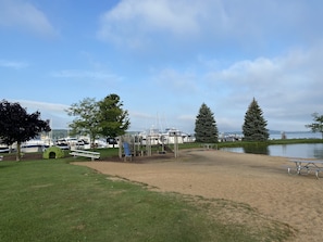 Playground at the beach across the street and brand new splash pad