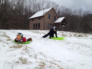 sledding in the front yard