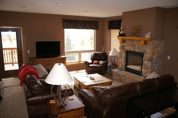 Large main floor family room with 55" flat screen TV