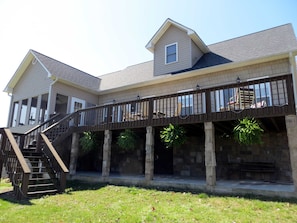 Back of house, large deck that over looks the lake.