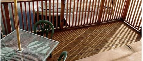 See the channel and marsh from the bi-level redwood deck