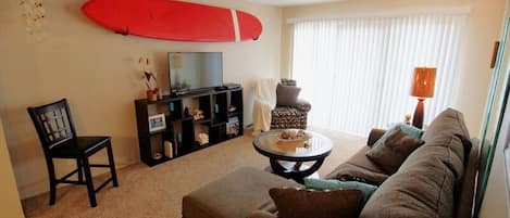 Spacious Living Room with Custom Surf Board