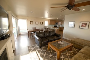 Spacious Living room with fireplace, flat screen TV and pullout sleeper.  