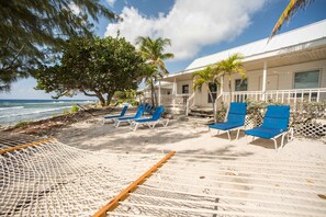 Relax on a sun lounger or hammock right outside your villa