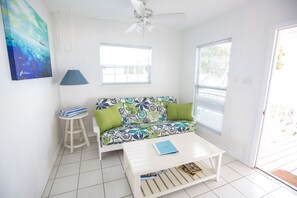 Living area with sofa bed and views out onto the water