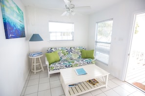 Living area with sofa bed and views out onto the water