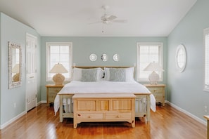 Primary bedroom w/ King bed, smart TV, and queen air mattress 