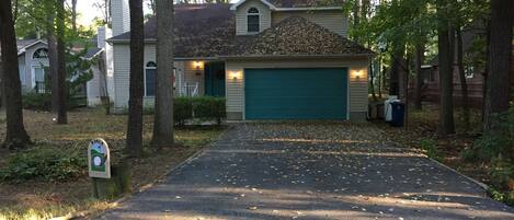 House is set back from road with wide and deep driveway!