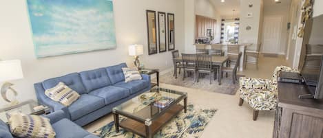 Living room with seating for six and flat screen television with cable TV