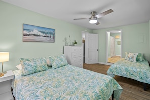 The bedroom and doorway to the bathroom.