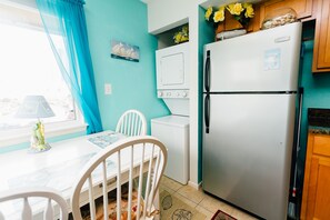 FULL SIZE STAINLESS STEEL FRIDGE AND A WASHER/DRYER COMBO
