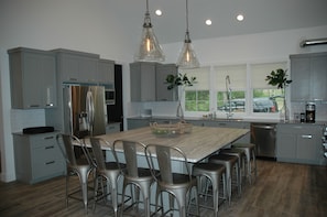 Main Level Kitchen with Large Island including seating for 12 on three sides.