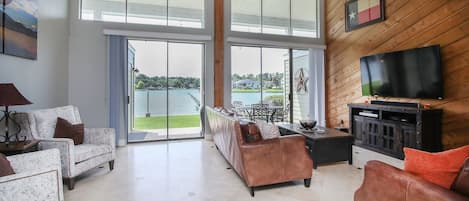 Large living area with plenty of seating and a great view of the lake.  