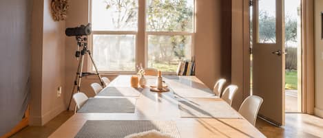 Inside dining table for small gatherings accompanied by Heath ceramics.