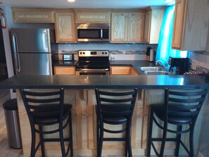 Kitchen area looking from Living area