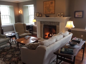 Living Room seating area with remote-operated gas fireplace.
