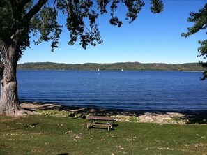 Park located behind the cottage with swimming beach and picnic tables. 