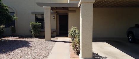 Condo has one car carport facing north.