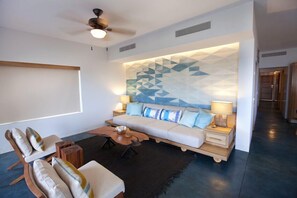 Custom wave art wall living area with walk out to pool and palapa area. 