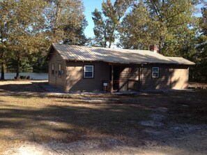 Newly remodeled cabin with rustic feel sitting on peaceful private pond. 