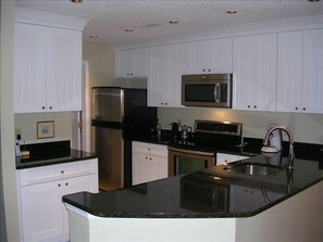 Newly remodeled kitchen with granite counter tops and new stainless appliances