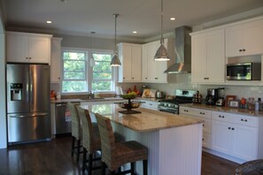 Gourmet kitchen with stainless steel appliances and granite countertops