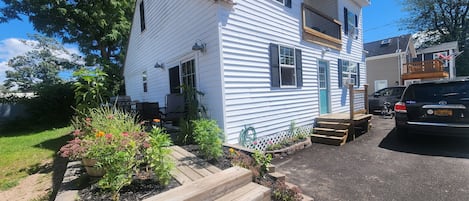 Front and left side. Deck for grilling enters into the kitchen.